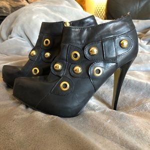 Black and gold studded heels